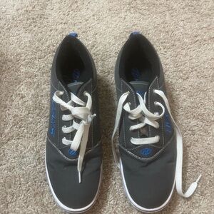 Heelys Men's Black and Blue Athletic Shoes skates on the bottom